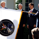 President Donald Trump, Vice President Mike Pence, and Defense Secretary Mark Esper looking at the U.S. Space Command flag